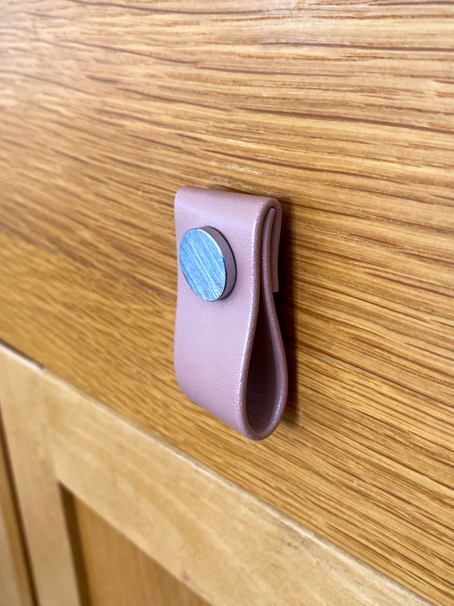 Cupboard door drawer pull, made with apple leather