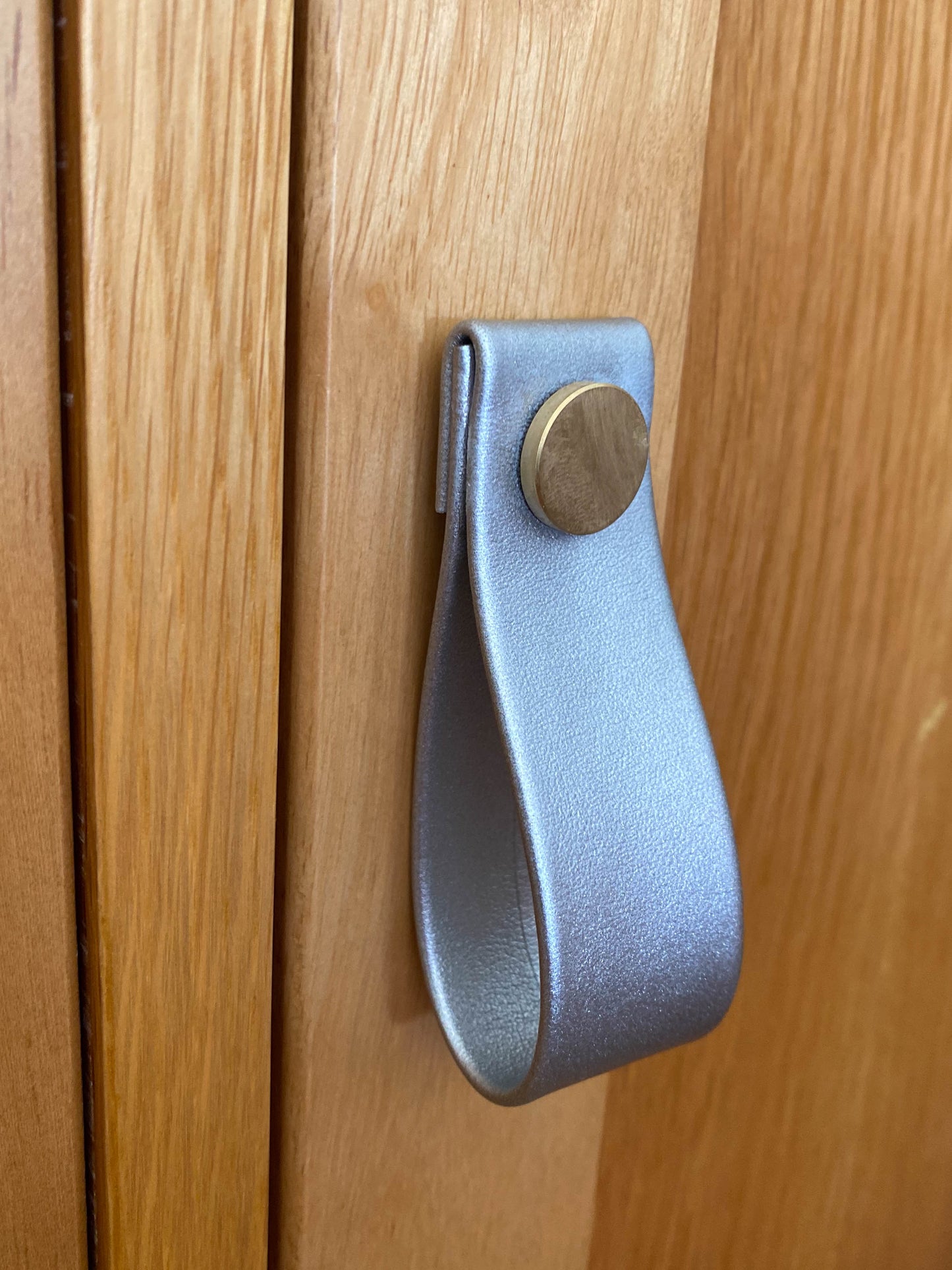 Cupboard door drawer pull, made with apple leather