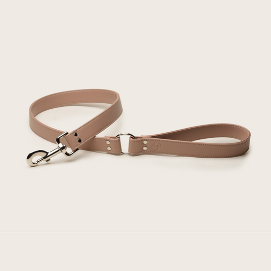 Vegan apple leather dog lead in blush pink. Artisan handcrafted with vegan apple leather